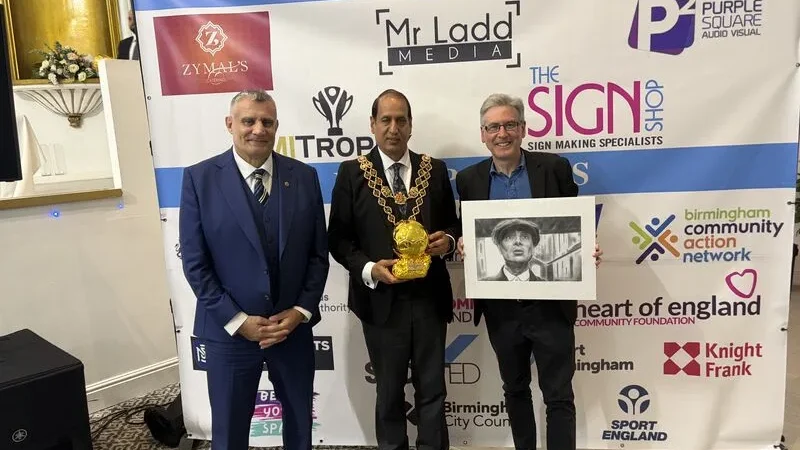 Paul Cadman with the Lord Mayor of Birmingham and a guest holding a framed Tommy Shelby print at the BYSA Players Awards