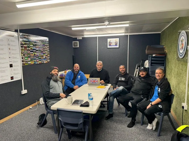 Birmingham Youth Sports Academy committee members around a meeting table